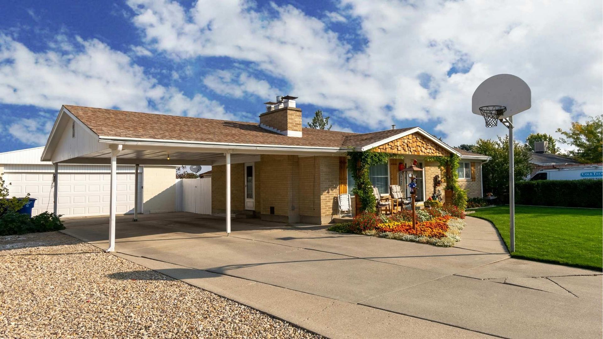A house with a basketball hoop in front of it