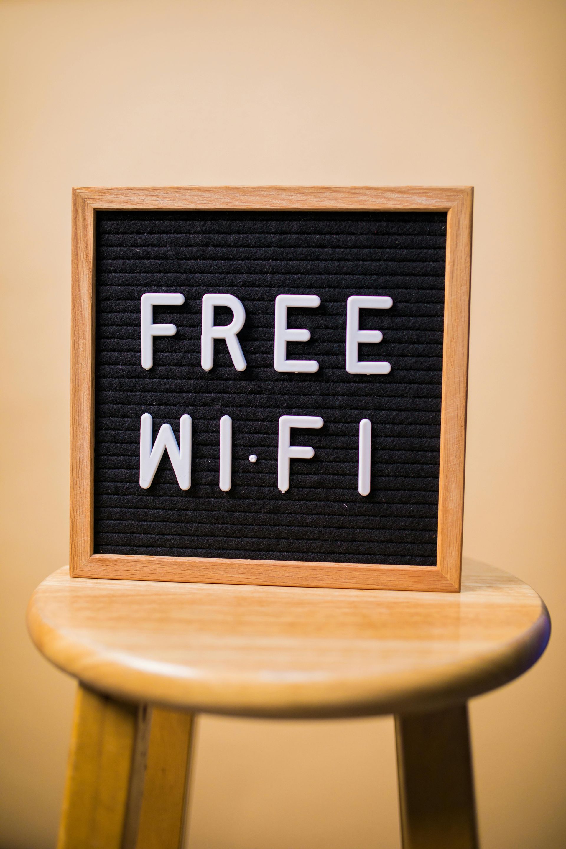 Sign on a wooden stool reads 