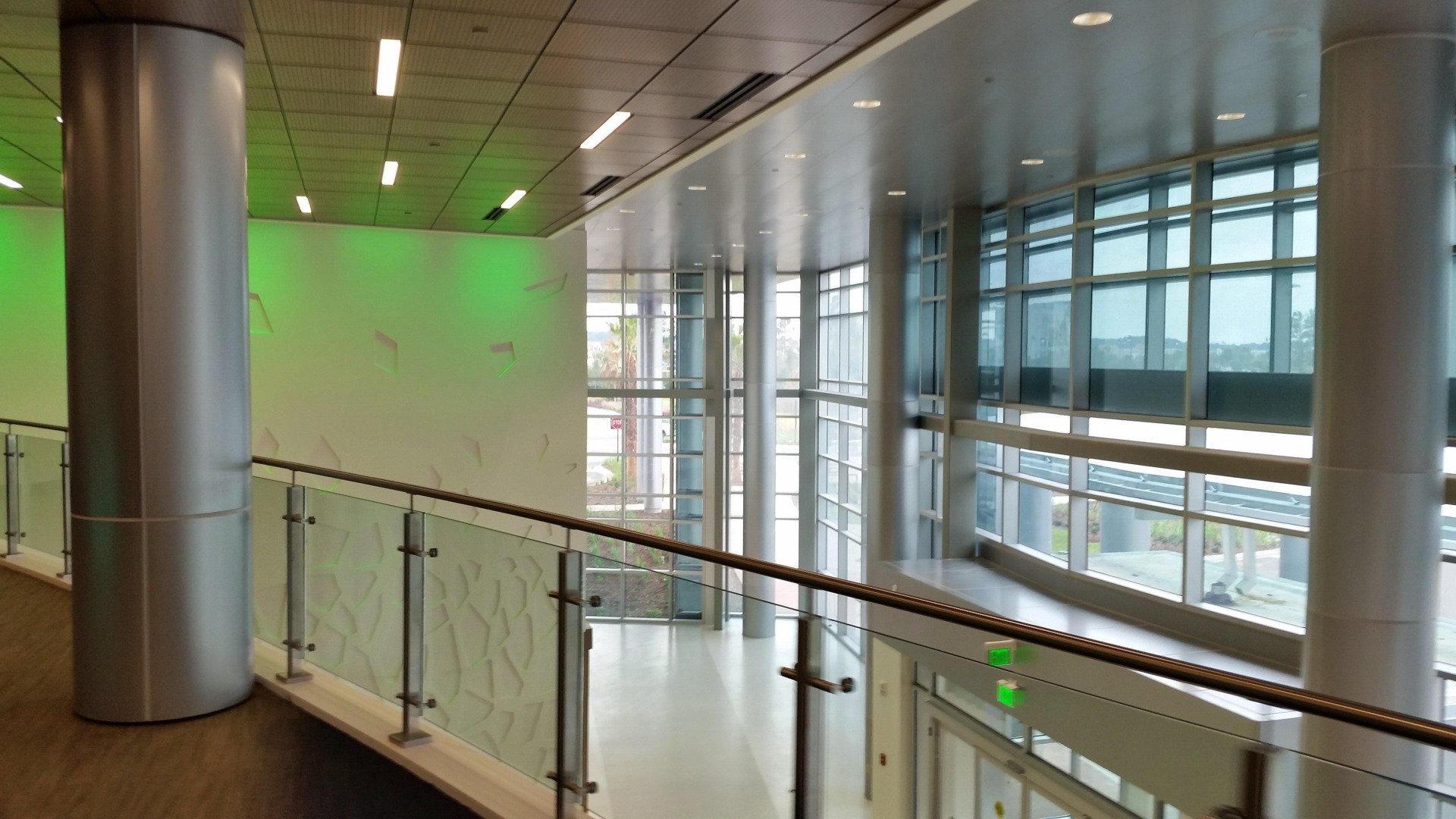 Worker Painting the Wall — Jacksonville, FL — Florida Paint Co Worker Painting the Wall — Jacksonville, FL — Florida Paint Co