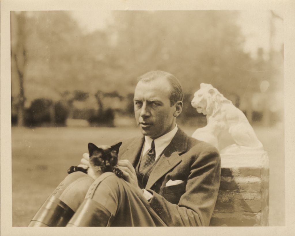 Robert Wood Johnson Jr. with Maggi Johnson’s Siamese cat, c. 1938. Morven Archive, Sheila Johnson Brutsch Collection.