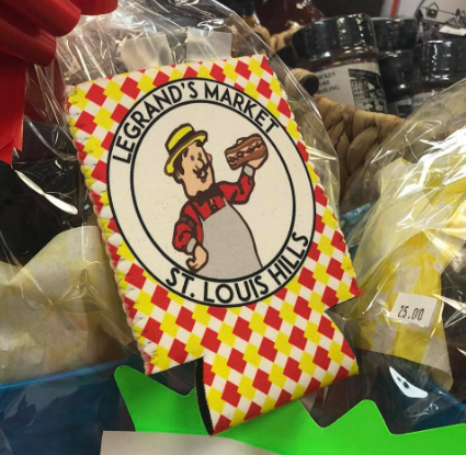 Legrand's Market can cooler with a cartoon chef, inside a basket. Red and yellow diamond pattern on the cooler.