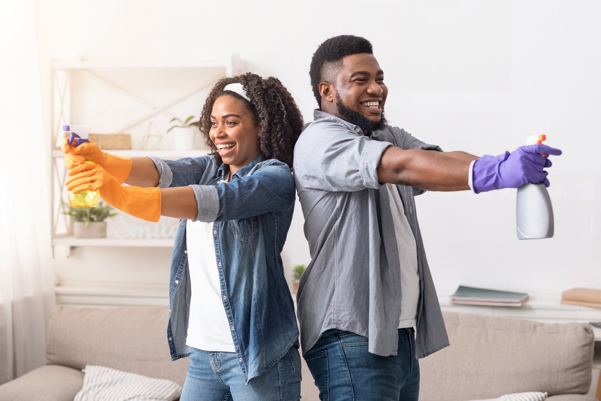 a couple having fun while cleaning