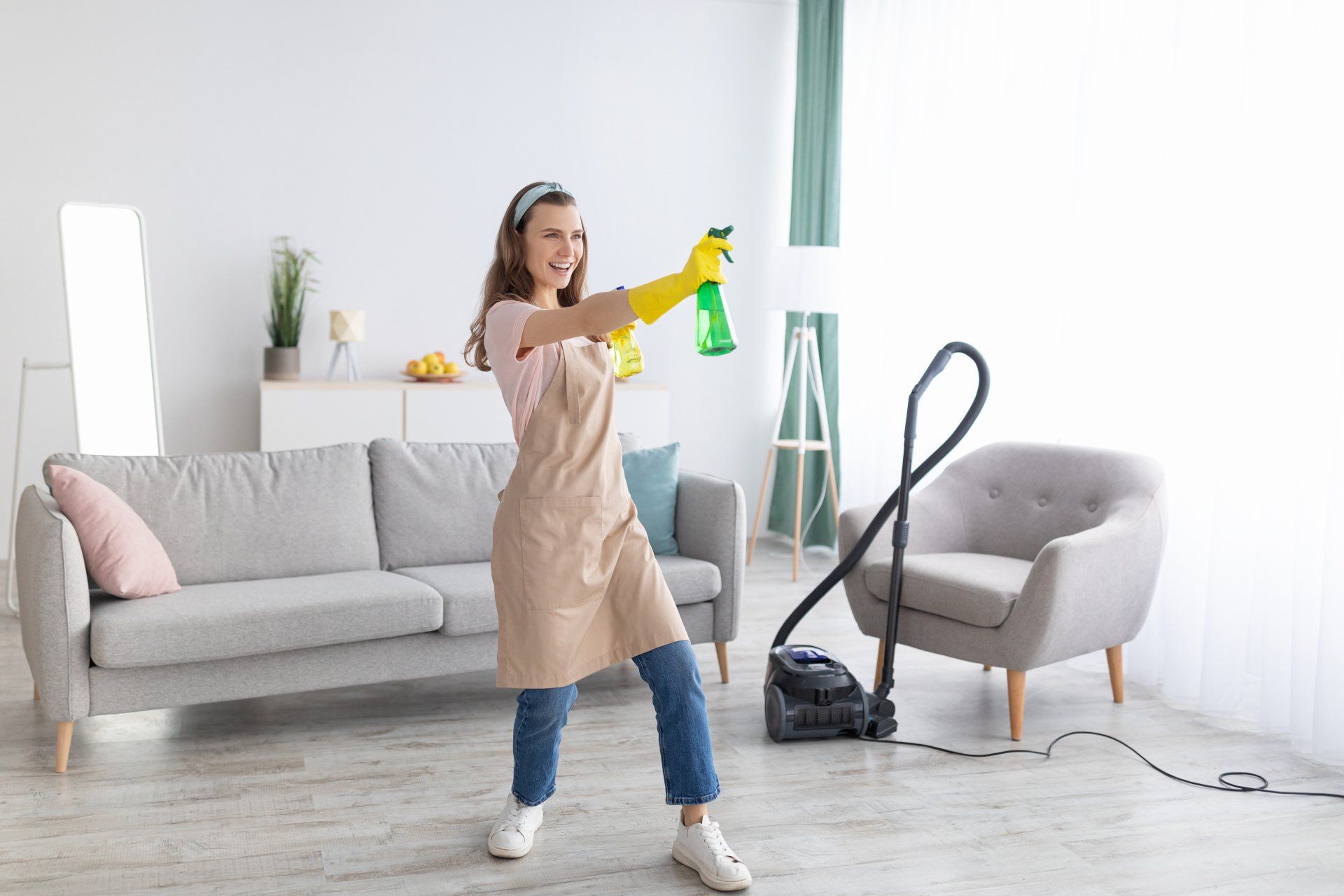 a woman having fun while cleaning