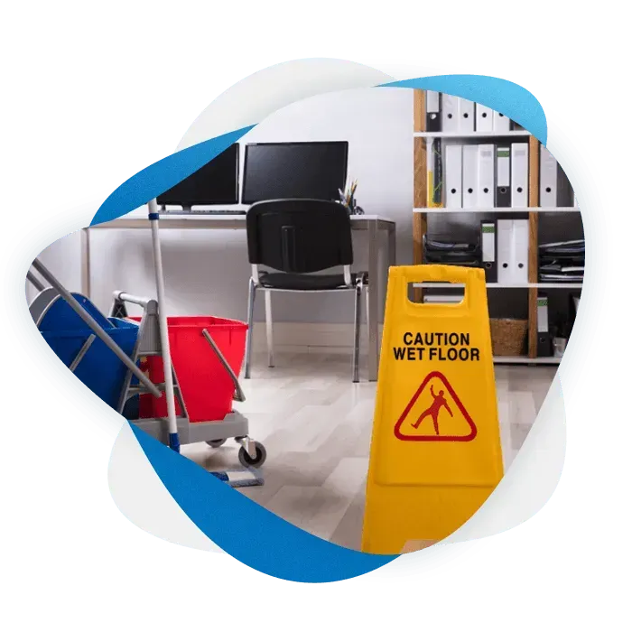 a janitorial trolley and a caution wet floor sign