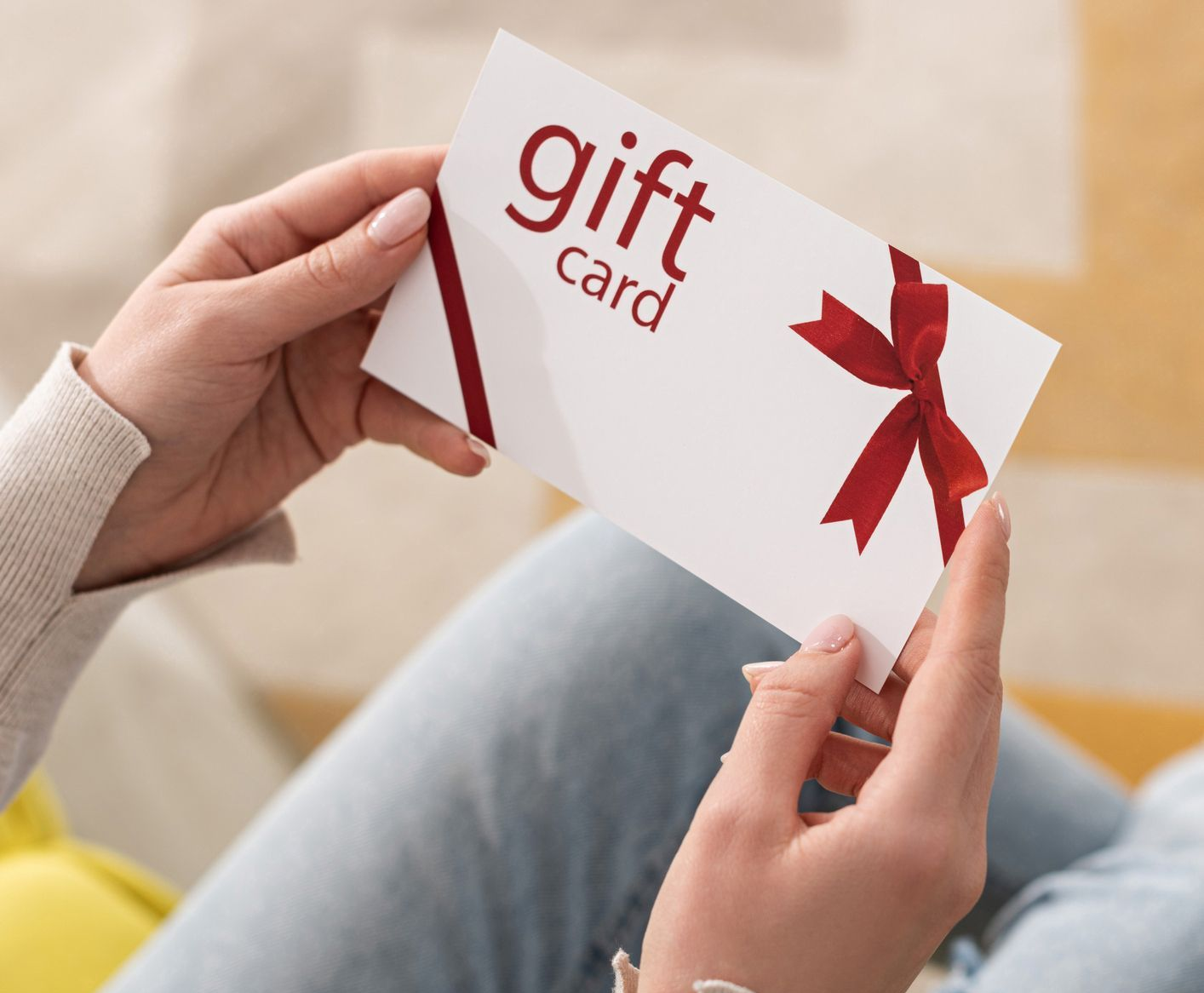 Lady holding a gift voucher for cleaning services from Elleisha's Property Services & Support (EPSS) in Newcastle