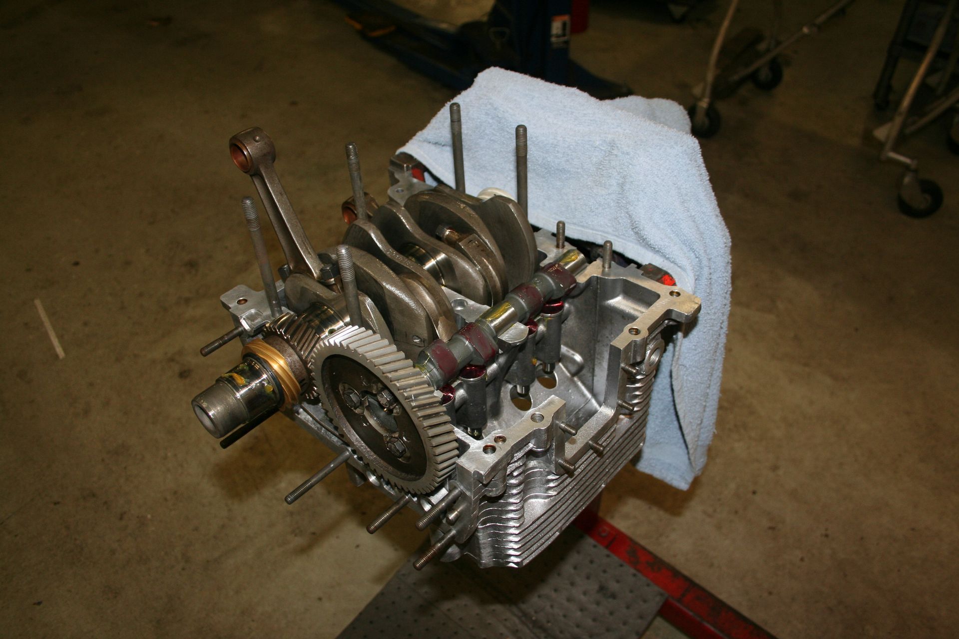 Partially assembled engine on a stand; shows internal components like the crankshaft and camshaft. | Autobahn Performance Inc