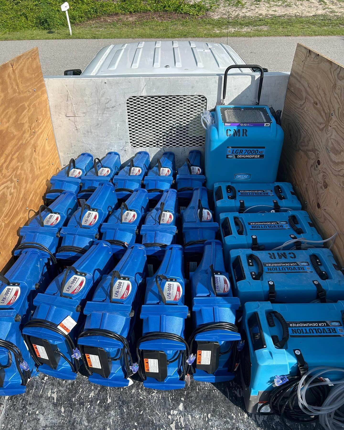 A bunch of blue boxes are sitting in a truck