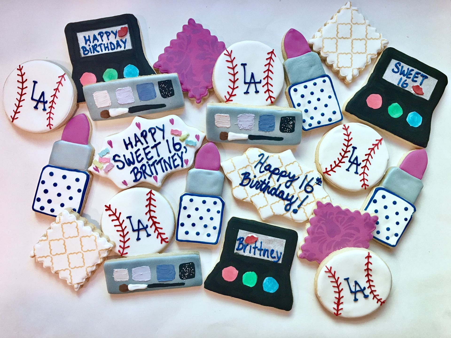Colorful ocean themed sugar cookies shaped like marine life and sunglasses.