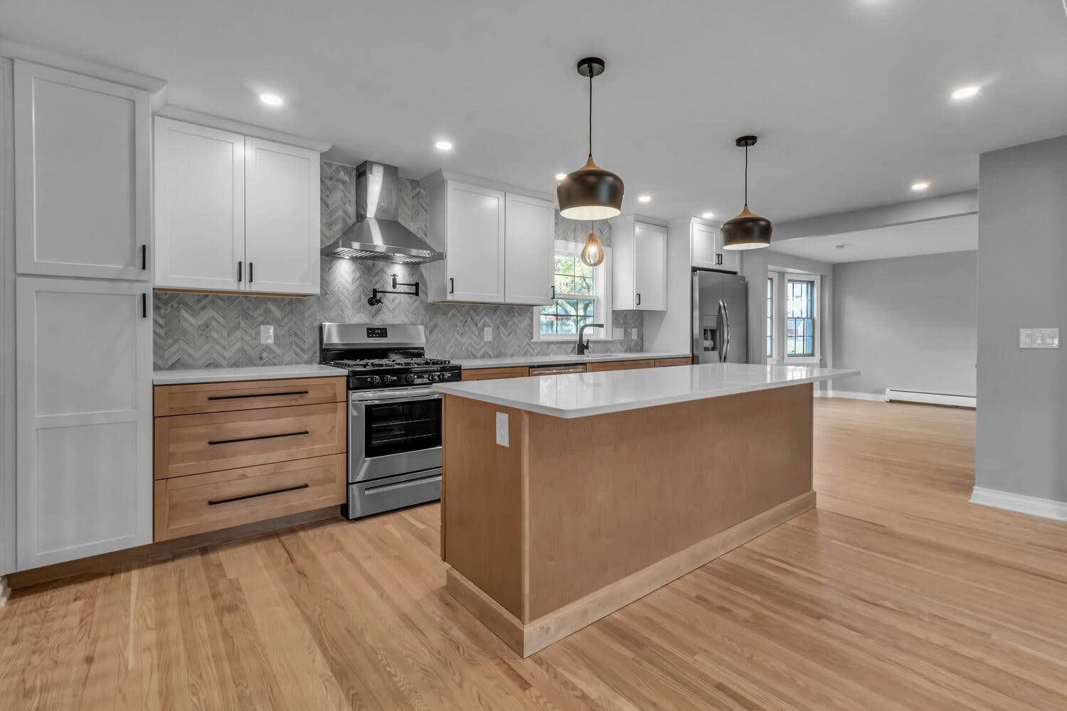 There is a large island in the middle of the kitchen.