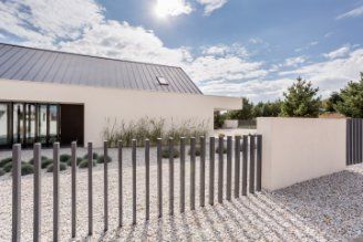 Spacious white house with customised metal fencing in Hobart TAS.