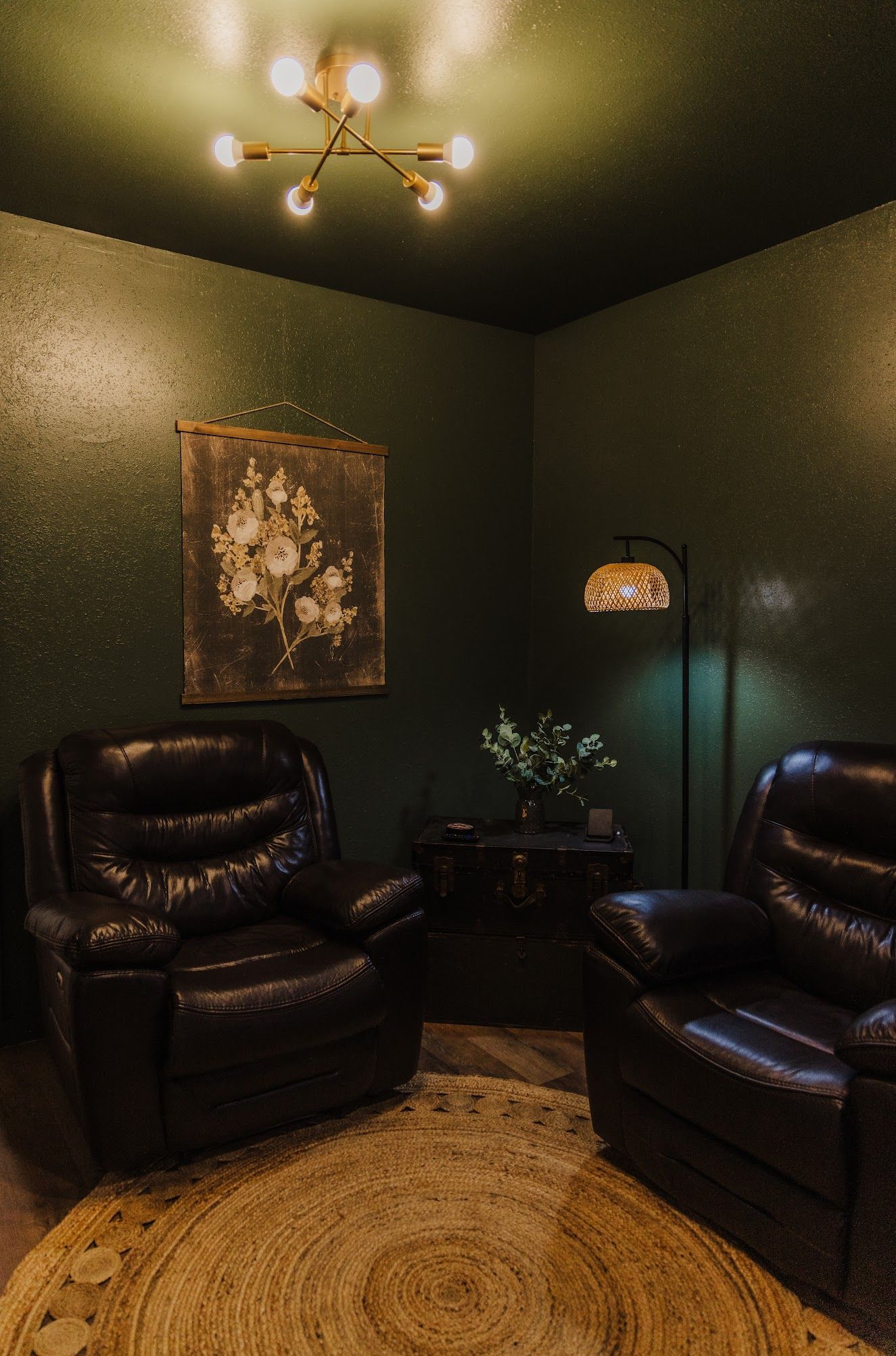 There are two chairs and a lamp in the room.