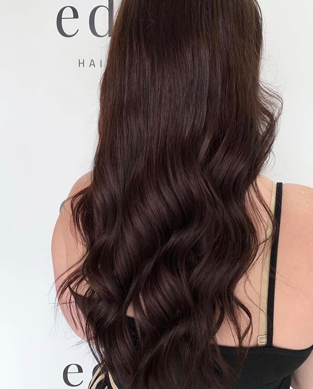 Woman With Long Wavy Hair - Hairdresser in Mackay, QLD
