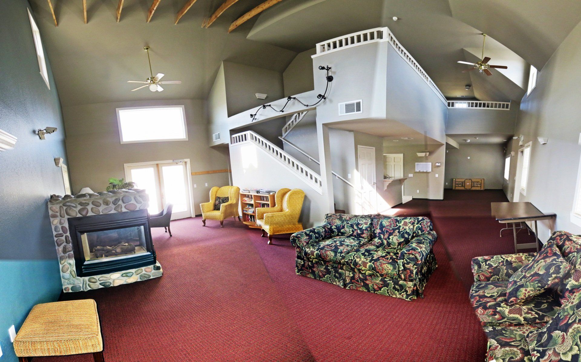 A living room filled with furniture and a fireplace