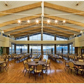 A large room with tables and chairs in it