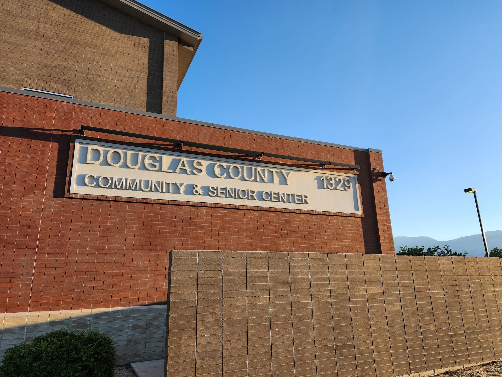 A brick building with a sign that says douglas county