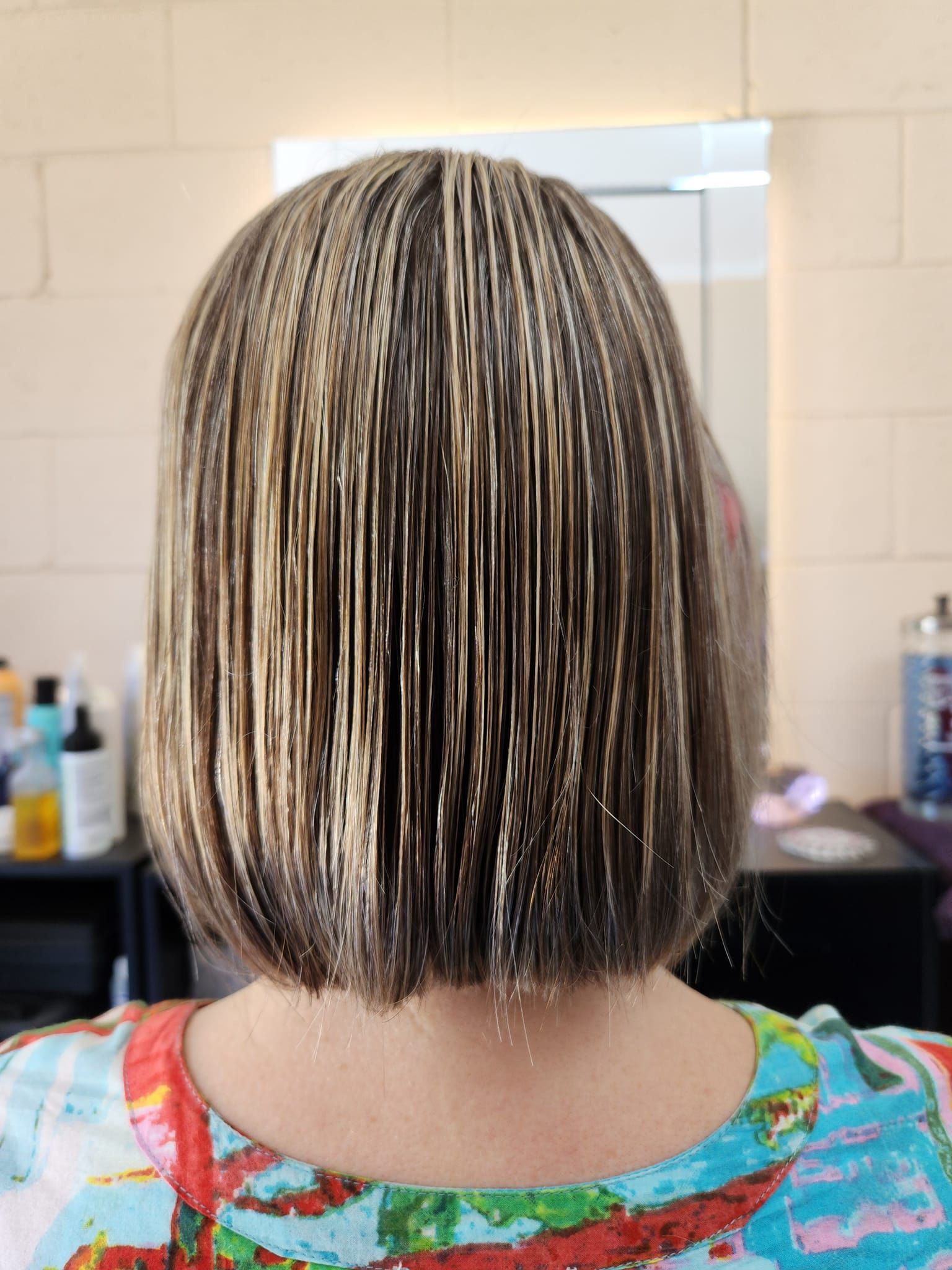 A Woman With Wet, Straight, Blonde-streaked Hair — Amore 'D' Hair Studio in Mudjimba, QLD