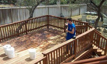 Man Cleaning The Wooden Terrace — San Antonio, TX — Deck & Patio Care by Barry Hagendorf