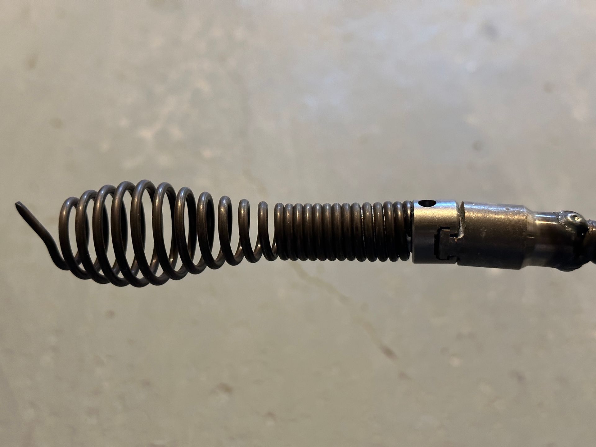 A close up of a metal object with a spiral on it.