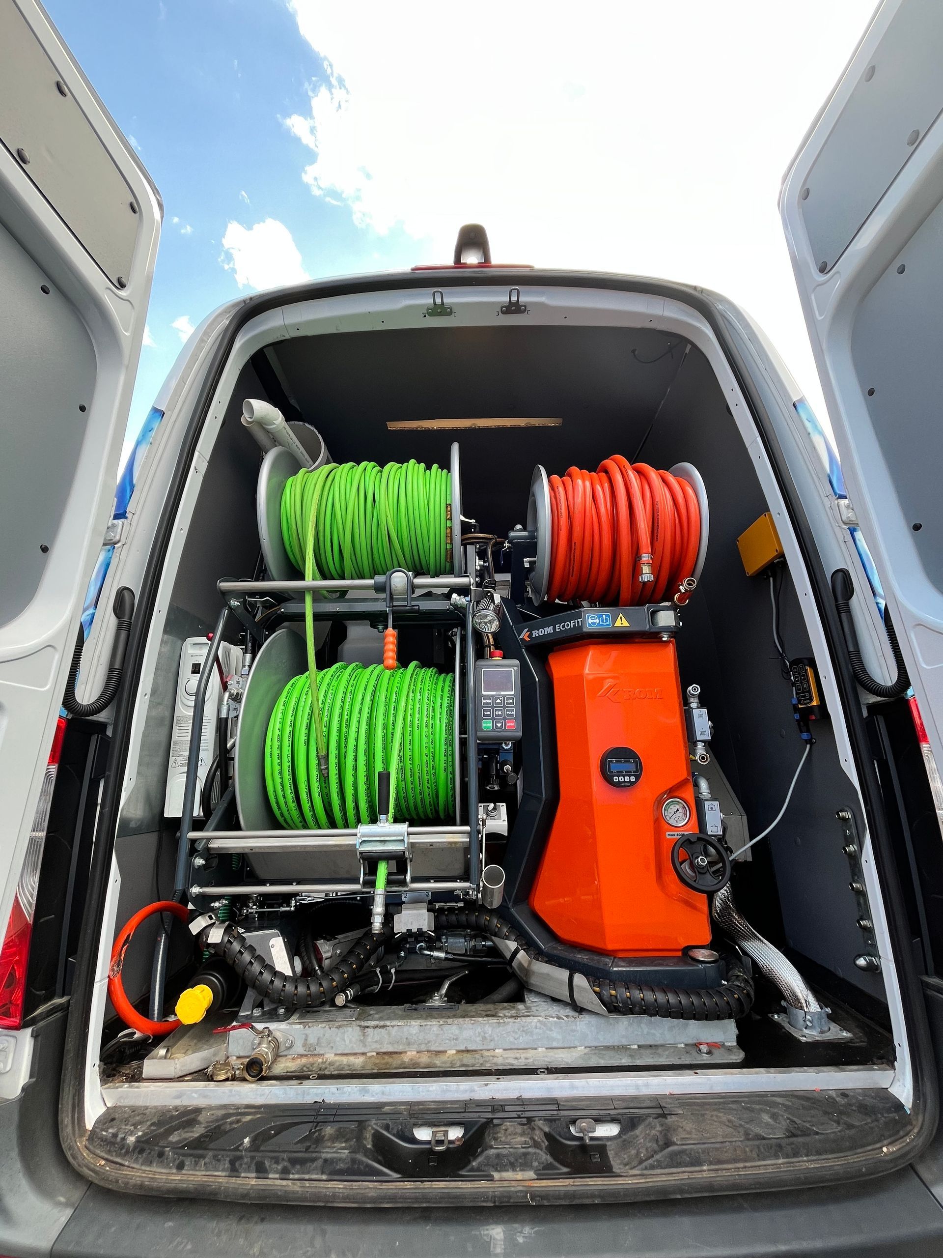 The back of a van with a bunch of equipment in it