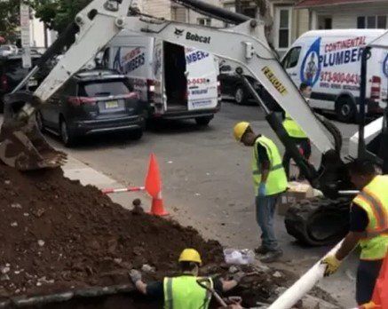A continental plumber van is parked on the side of the road