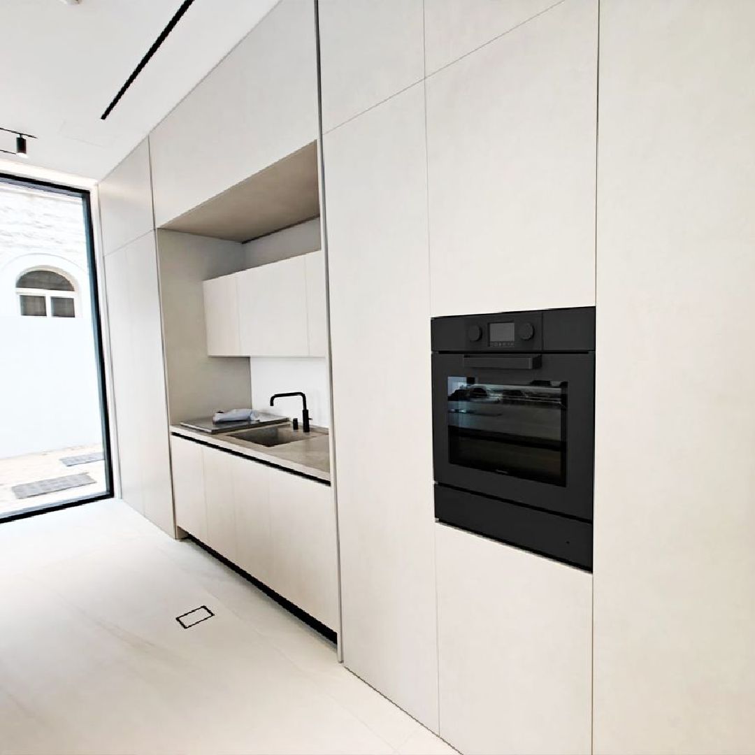 Luxury show kitchen in Dubai villa with marble island and premium craftsmanship by Concept Art Decor.