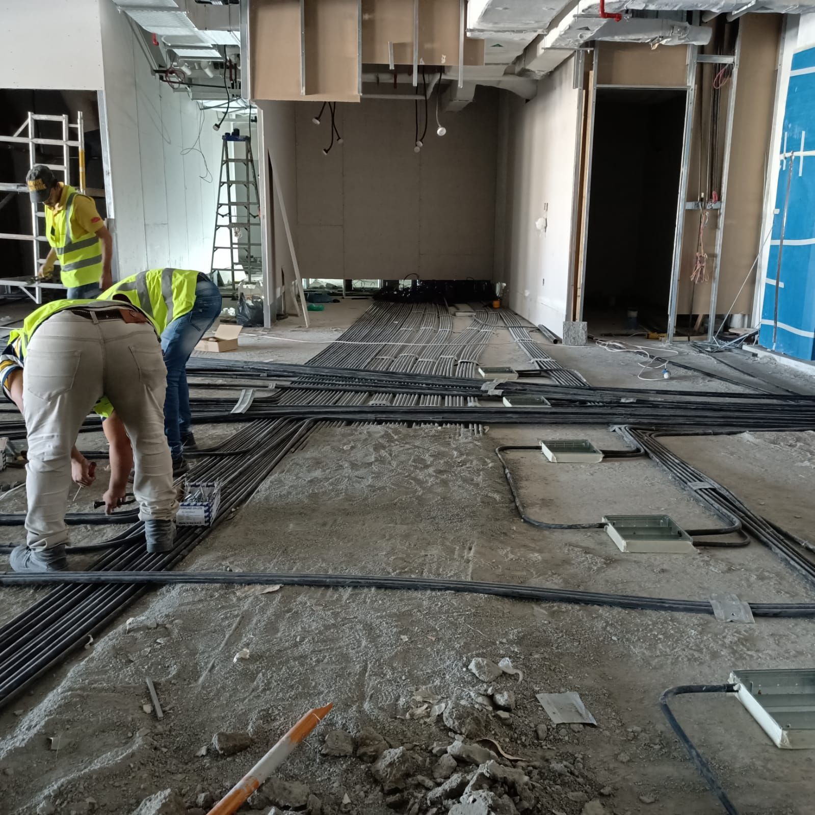 MEP contractor installing electrical panel