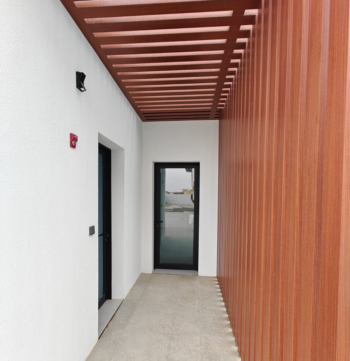 Villa outdoor man-cave lounge in Dubai with bespoke finishes and lighting by Concept Art Decor.