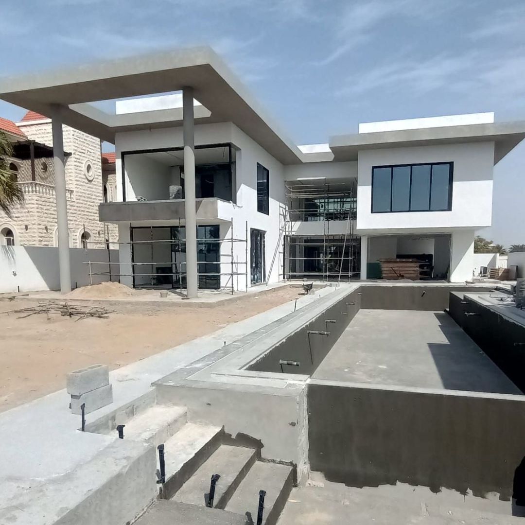 Luxury Dubai villa renovation showing exposed joinery, wood panels, marble works and premium fit-out. 