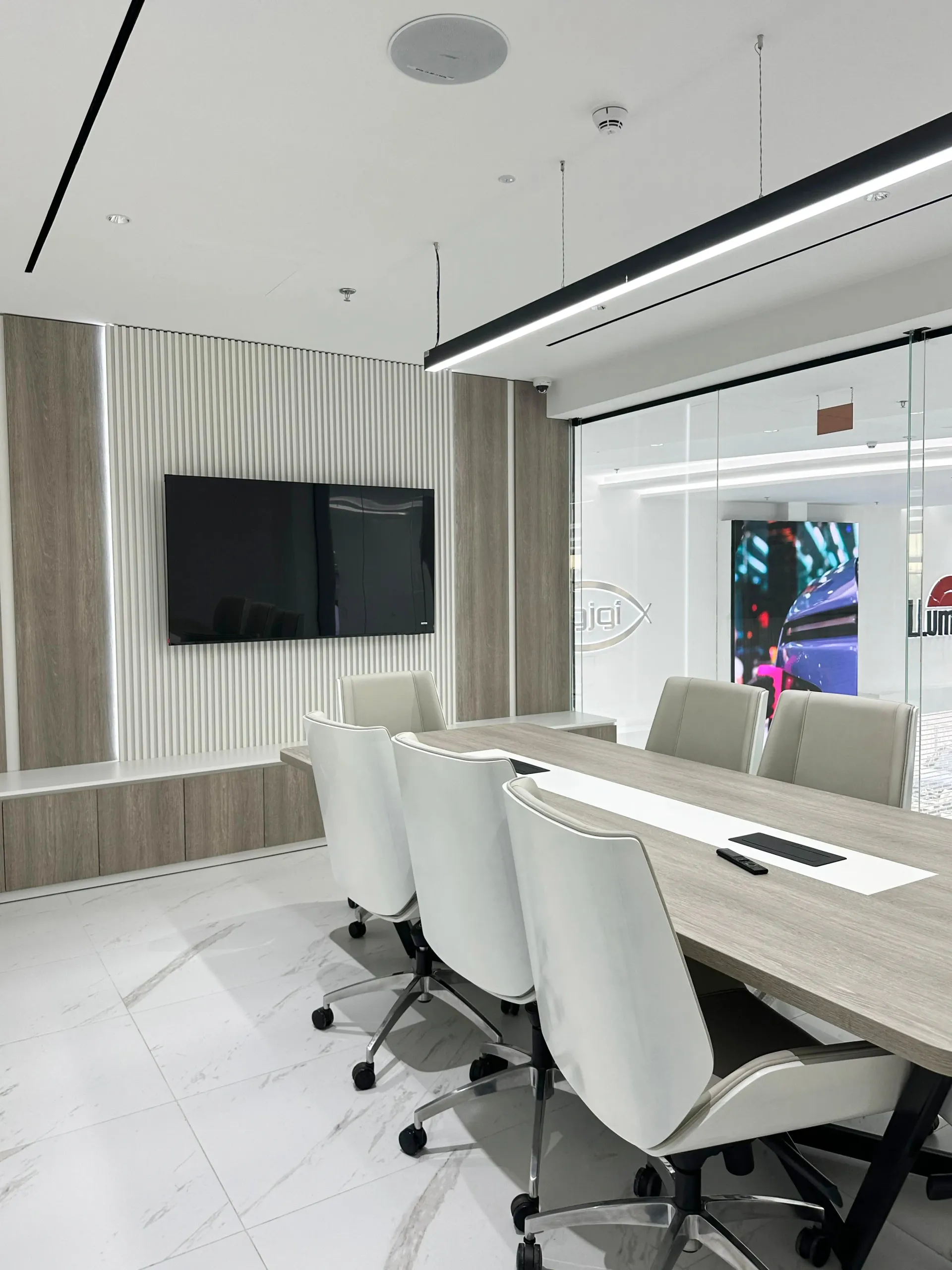 Luxury showroom meeting room interior fit-out in Dubai with modern finishes and integrated AV by Concept Art Decor
