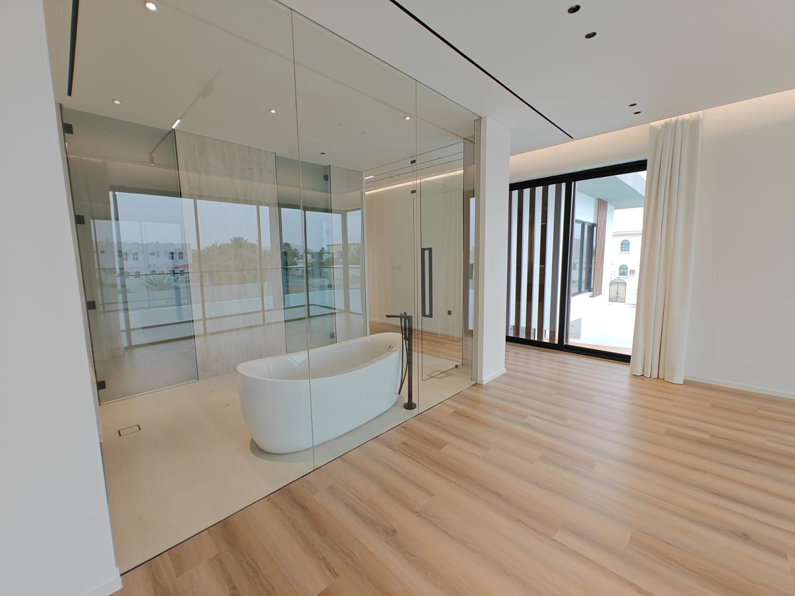 Master suite luxury bathroom in Dubai villa with calm luxury finishes by Concept Art Decor.