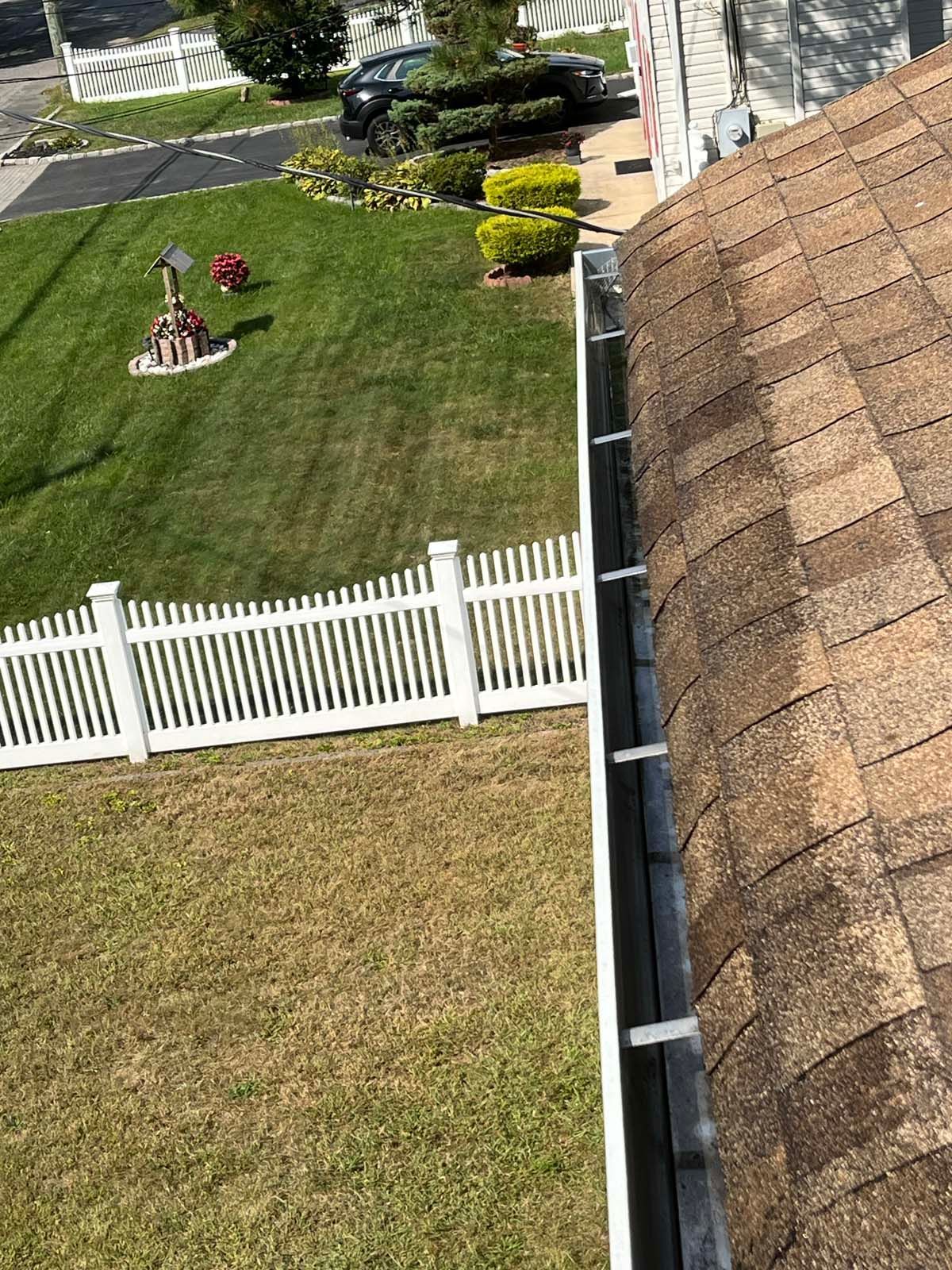 An aerial view of a gutter on the roof of a house.