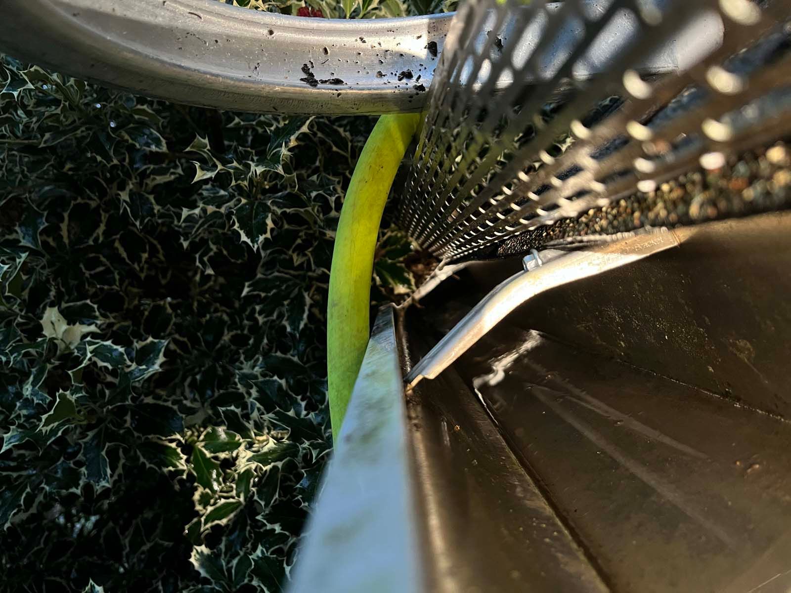 A close up of a strainer with a yellow hose coming out of it