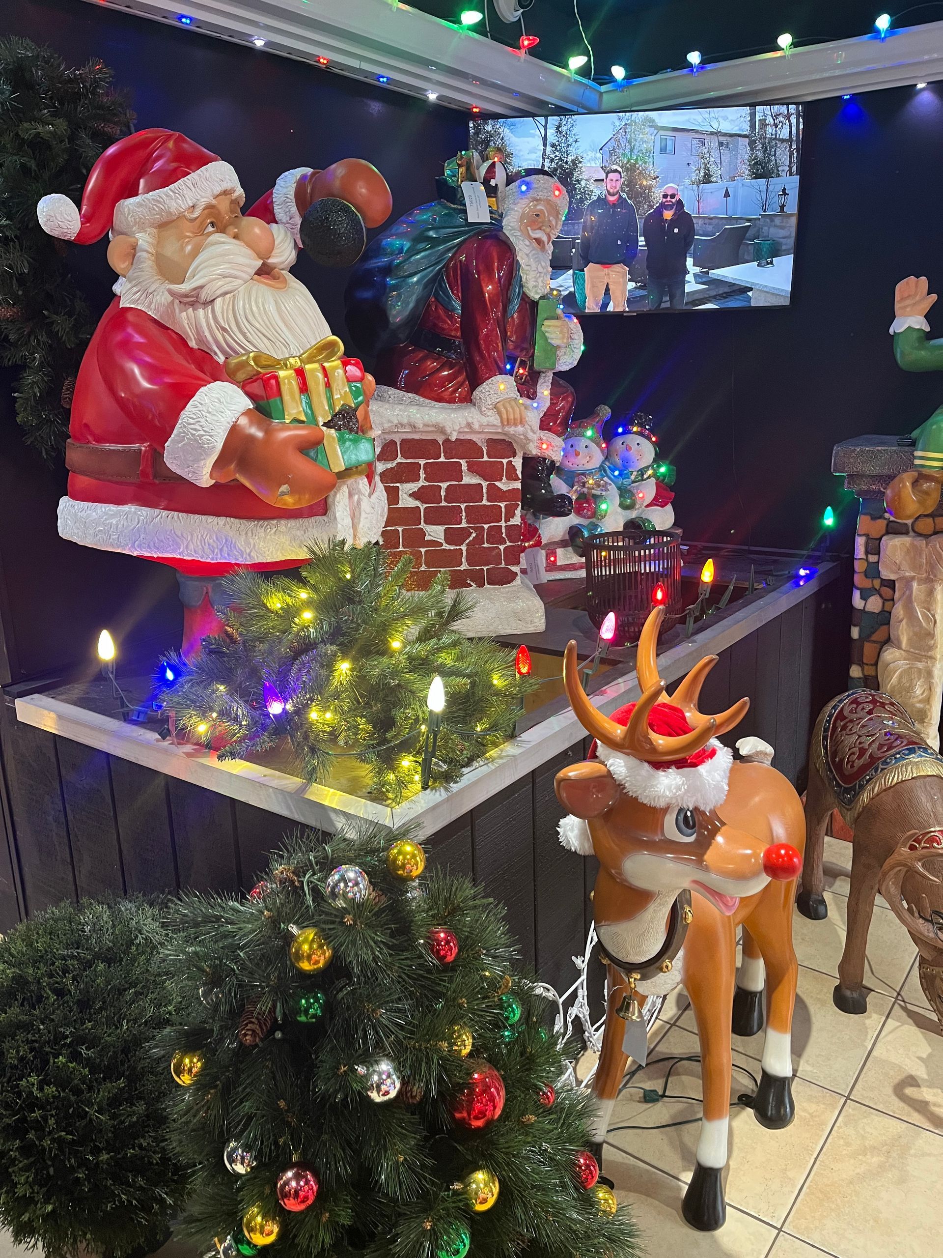 There are a lot of christmas decorations in the room.