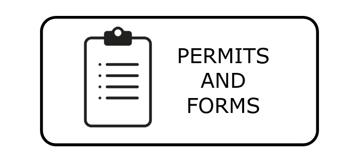 A clipboard with the words `` permits and forms '' written on it.