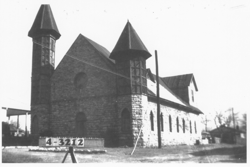 A black and white photo of a church with a sign that says e2637f2