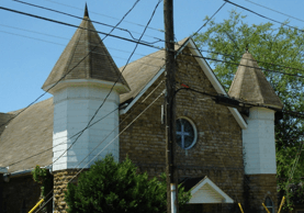 A church with a cross on the front of it