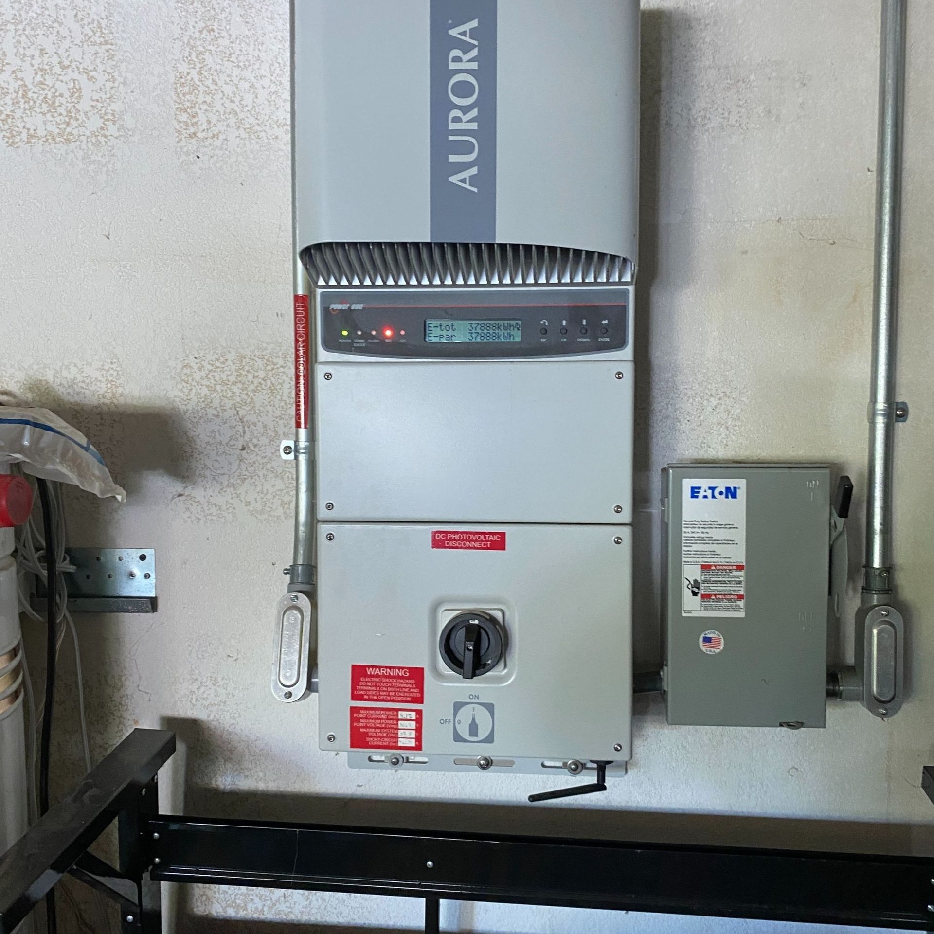 The Electric Pro - A wall mounted aurora box with a clock on it