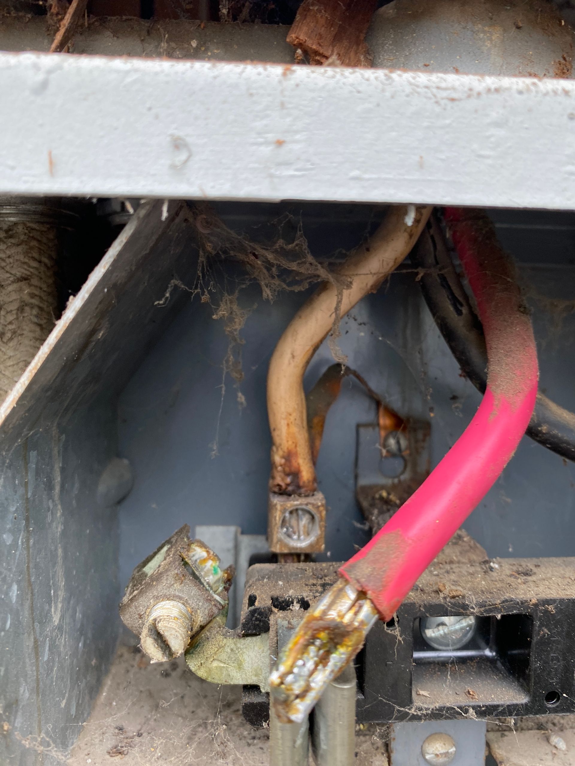 The Electric Pro - A close up of a dirty electrical box with wires coming out of it