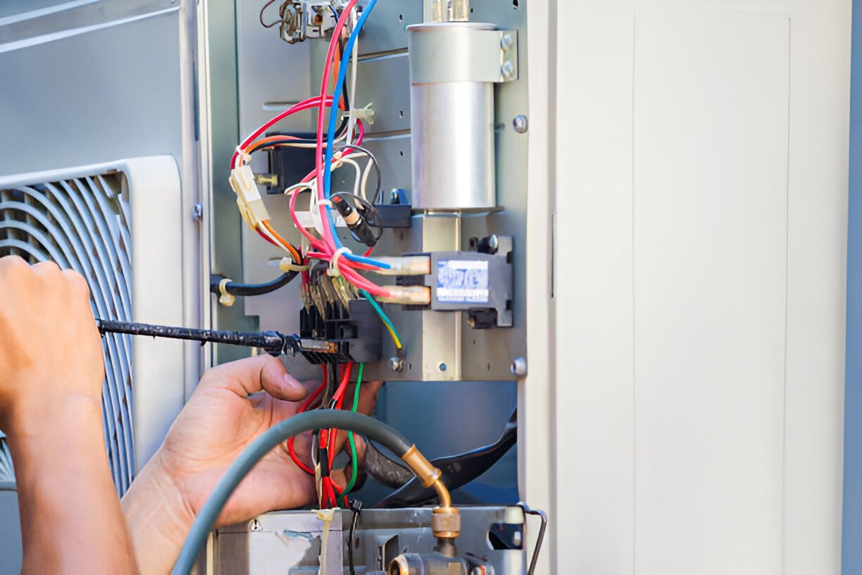 The Electric Pro - Technician performing electrical service on smart HVAC system wiring and components