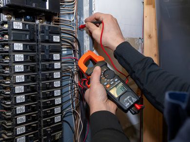 The Electric Pro - Electrician performing main service panel upgrade with voltage meter in Santa Rosa, CA