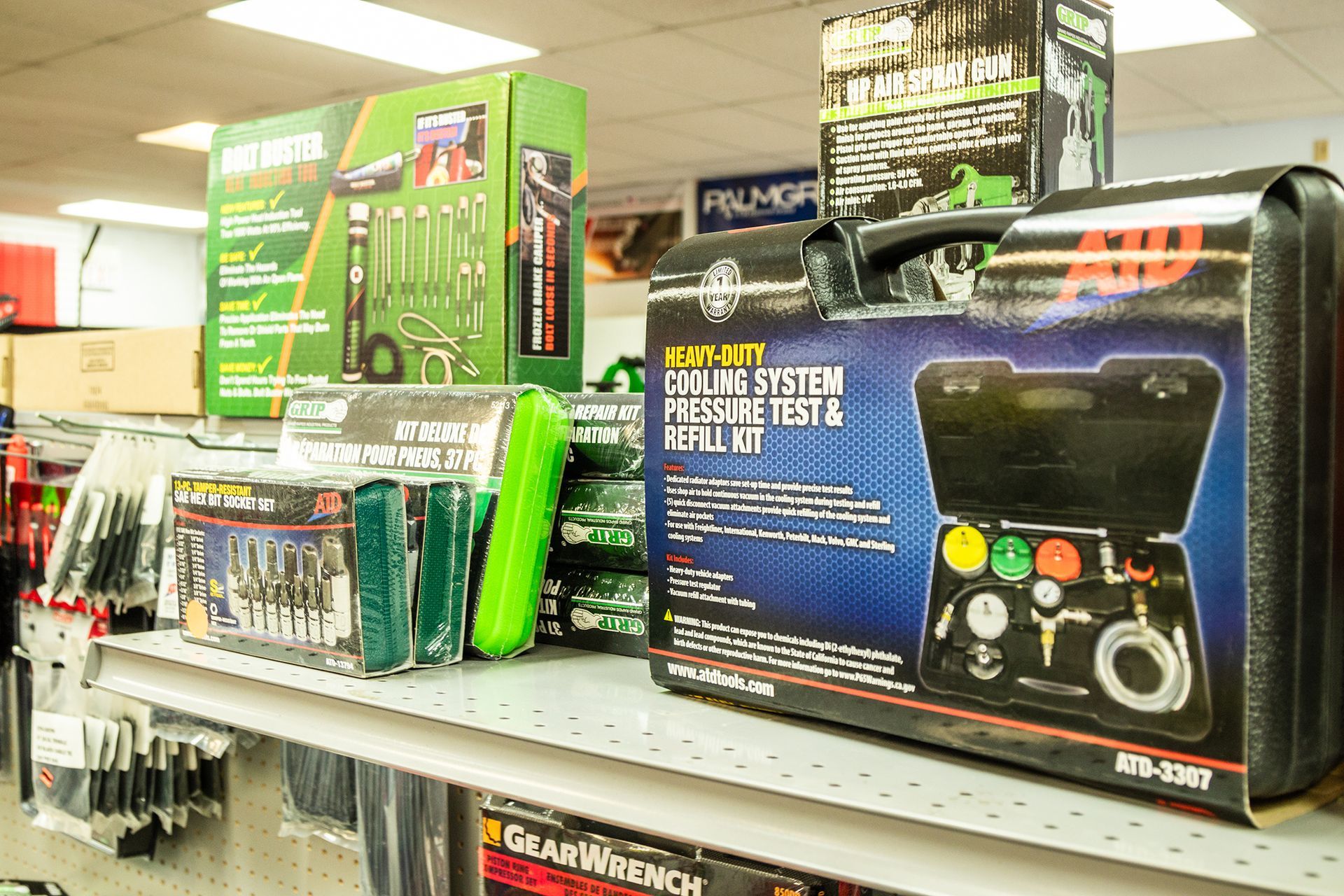 A bunch of tools are sitting on a shelf in a store.