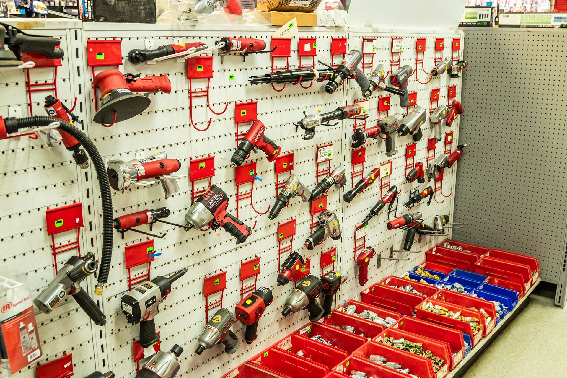 A wall filled with lots of tools in a store.