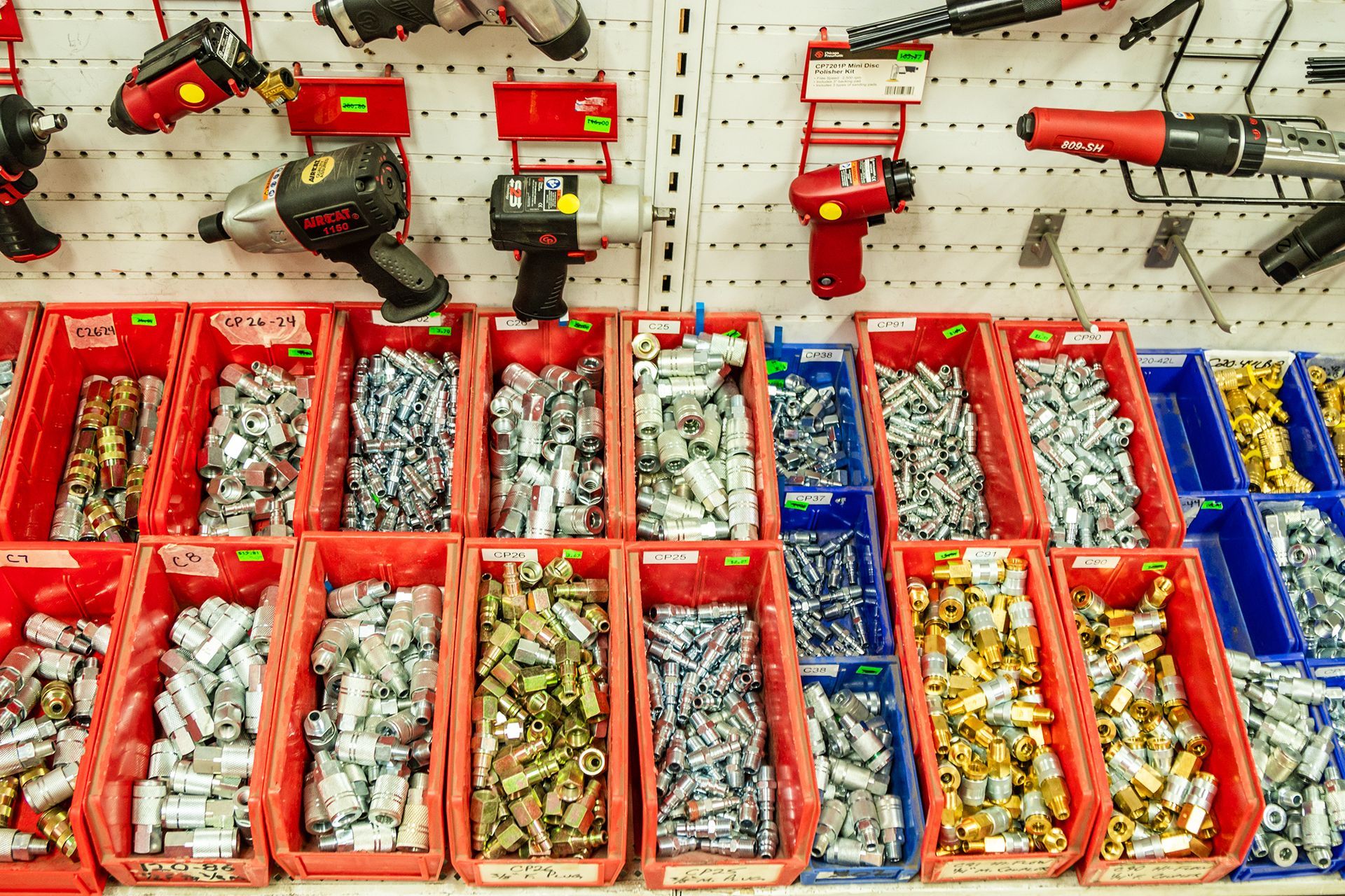 A display of tools and screws in a hardware store.