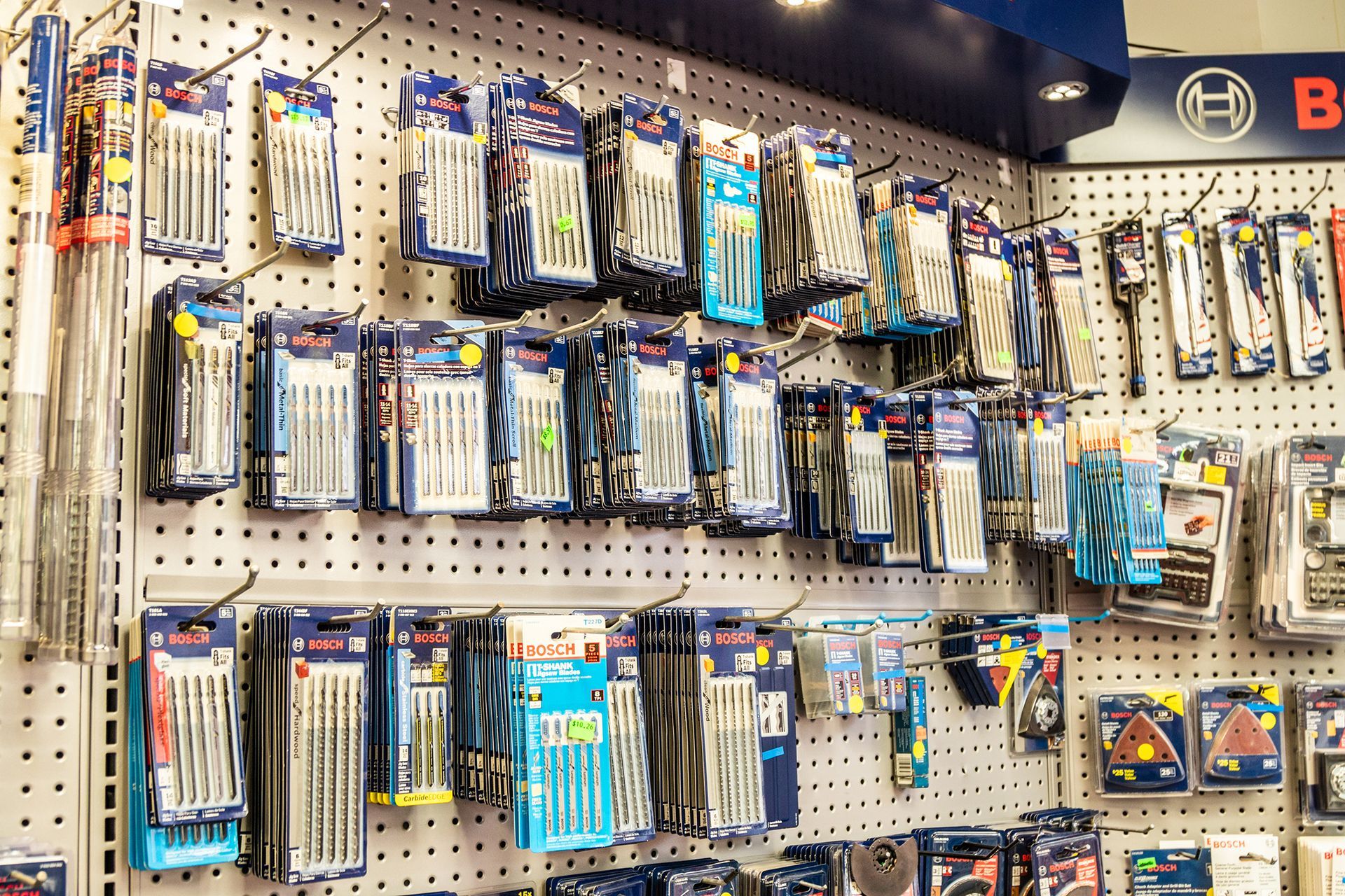 There are many different types of drill bits on display in this store.
