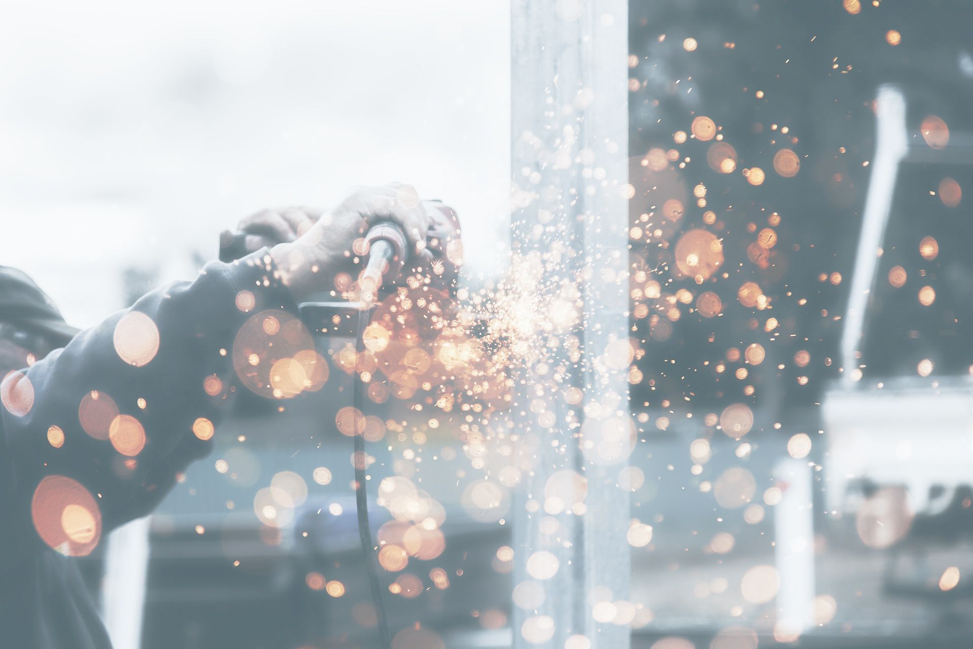 Angle grinder person holding tool during daytime