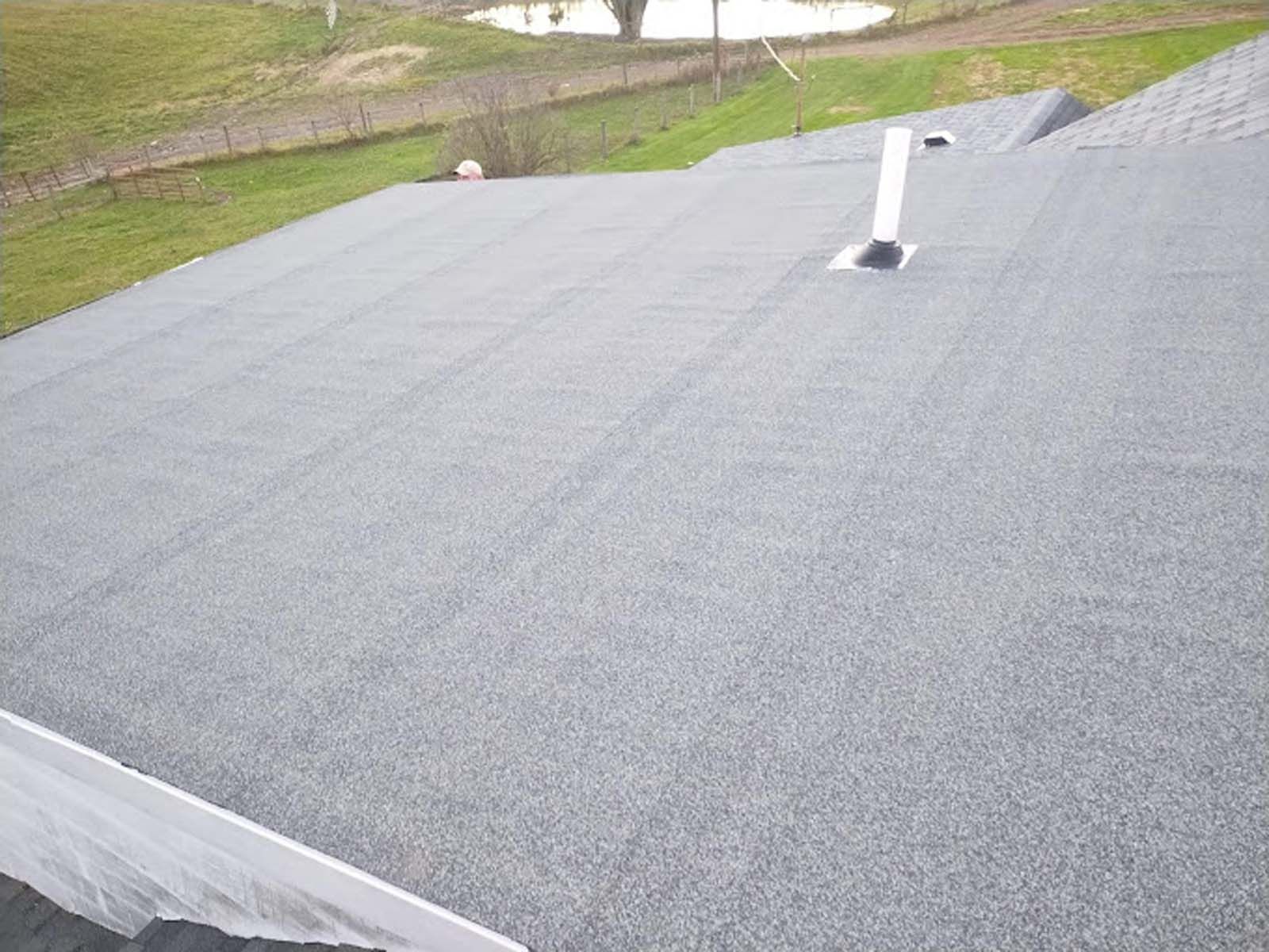 A close up of a roof with a chimney on it