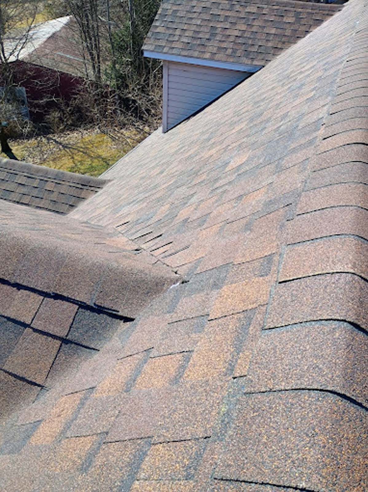 A close up of a roof with shingles on it.