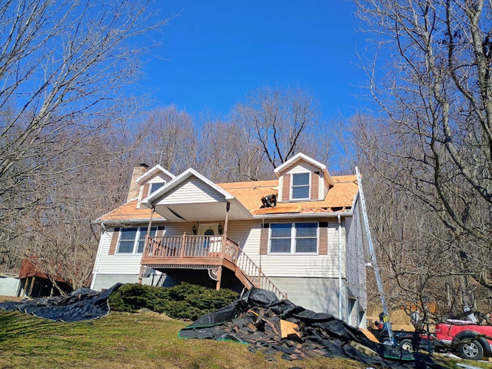 A house is being remodeled with a new roof.