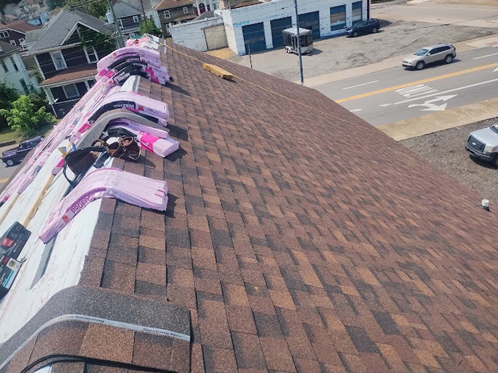 A roof with a lot of pink flags on it