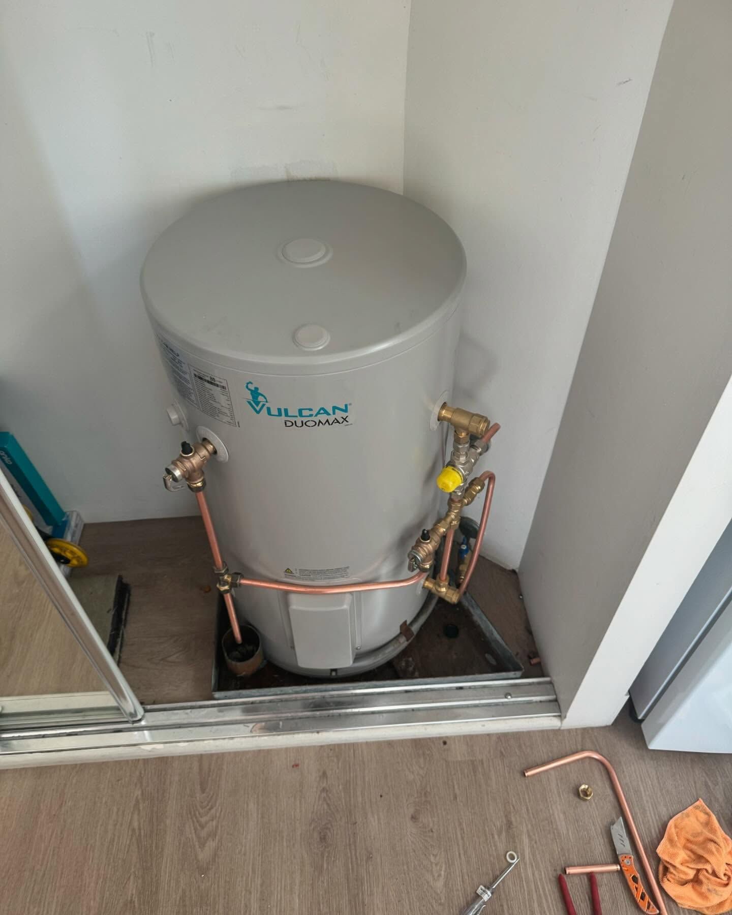 Vulcan Electric Hot Water Heater in a Closet — C’s Plumbing & Gas Gold Coast in Brisbane, QLD